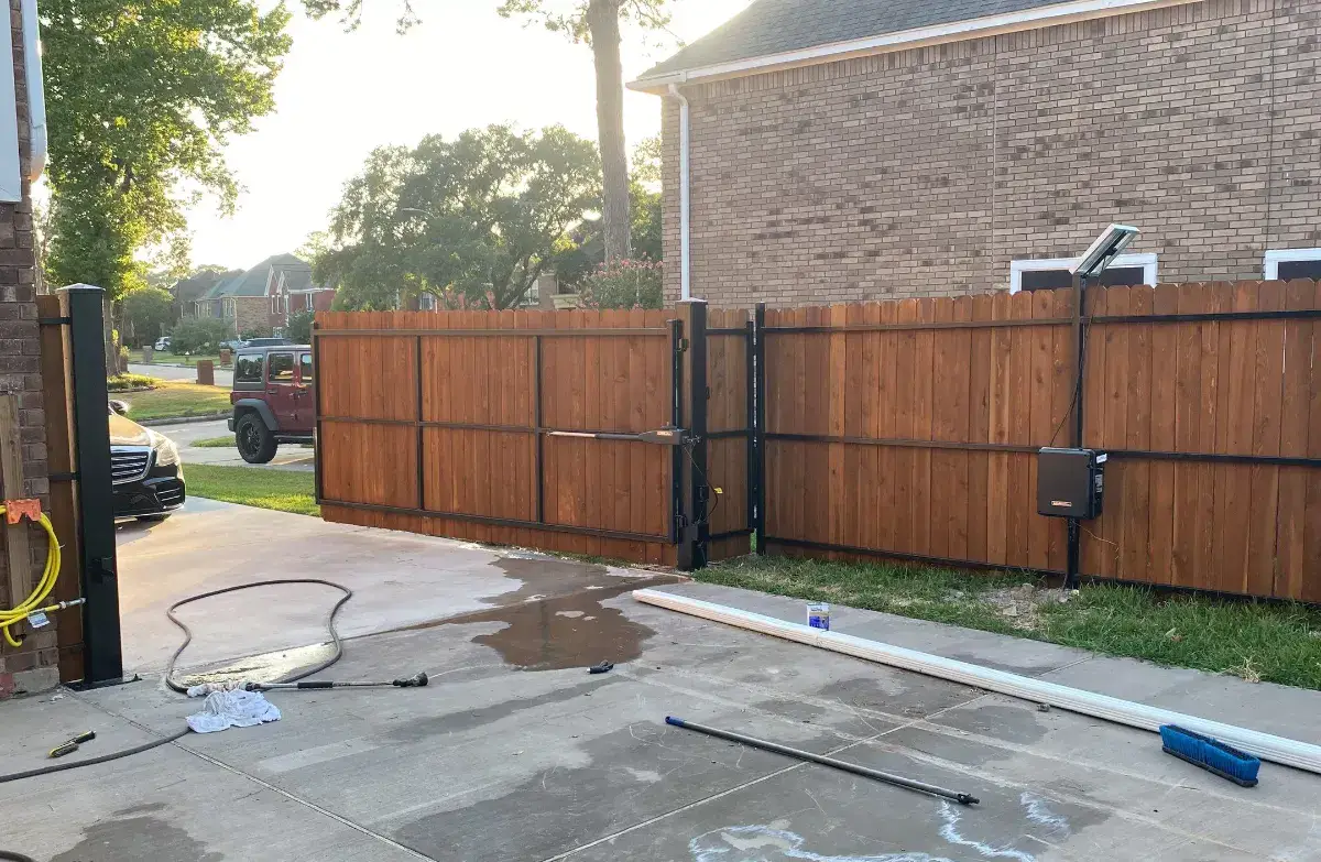 Automatic driveway gate installed by Astro Outdoor Designs